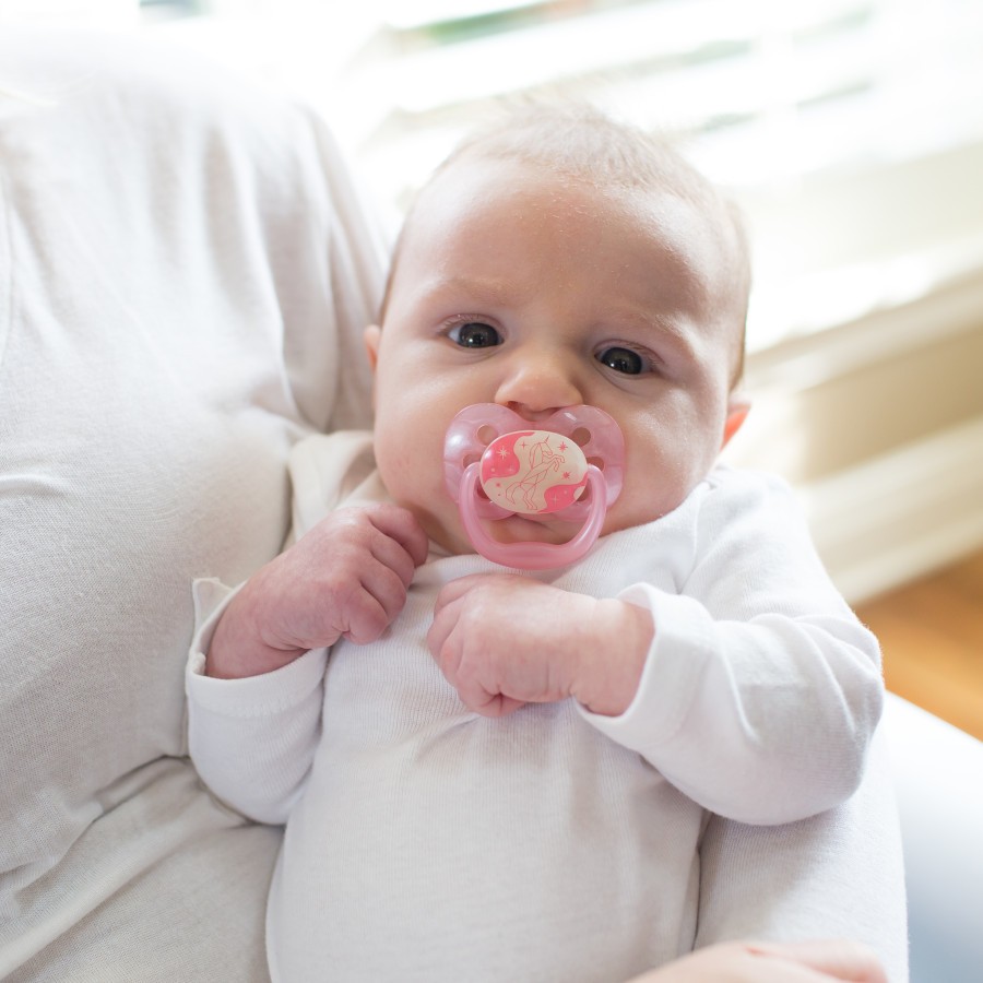 Lifestyle_Advantage_Glow_in_the_Dark_Stage_1_O16A9030 Baby in mother's arms with pacifier in mouth